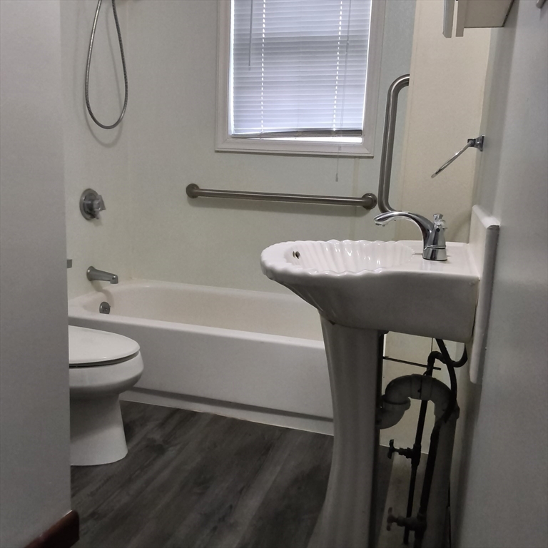 212-218 Lowell Street, Unit 1E Fall River, MA 02721 - Photo 10 of 10 a bathroom with a sink a toilet and shower