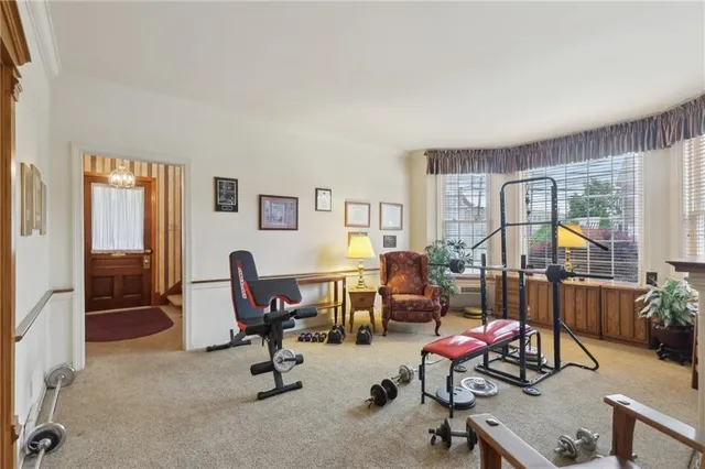 a view of a livingroom with workspace and a couch