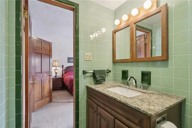 a kitchen with sink and refrigerator