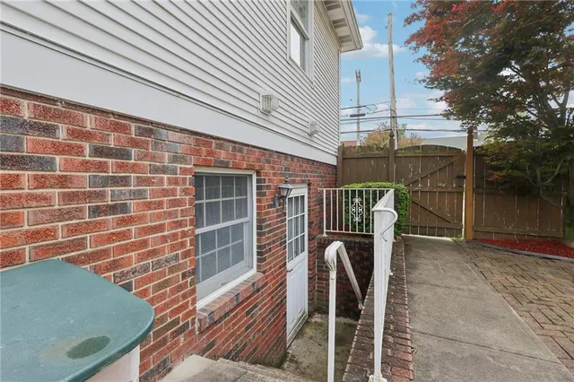 a front view of a house with stairs