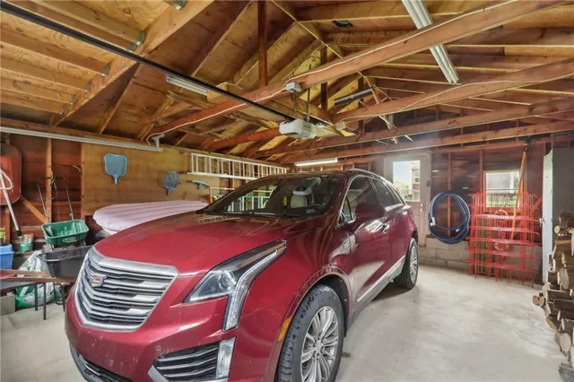 a view of a garage with a car parked