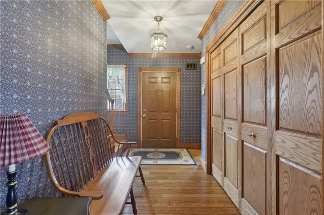 a view of entryway with wooden floor
