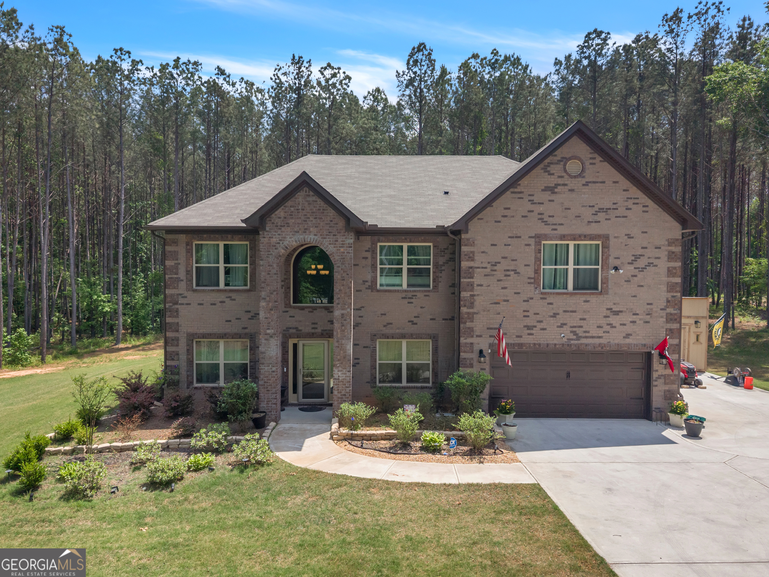 11614 Alcovy Road Covington, GA 30014 - Photo 1 of 62 a front view of a house with a yard and garage