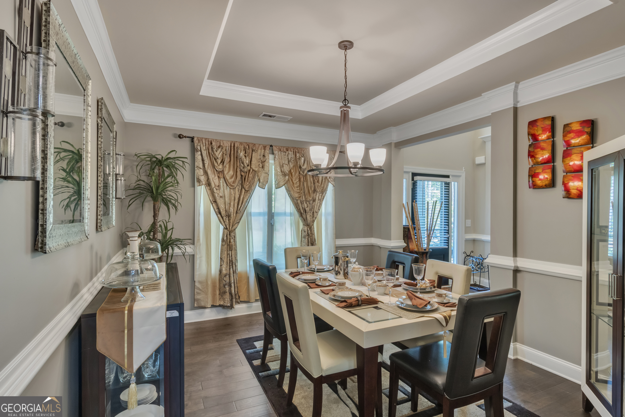 11614 Alcovy Road Covington, GA 30014 - Photo 14 of 62 a view of a dining room with furniture window and wooden floor