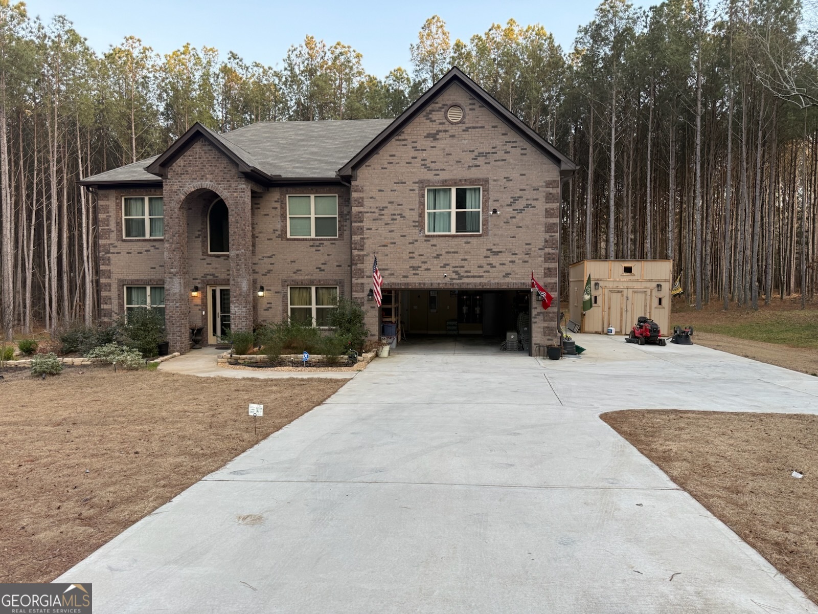 11614 Alcovy Road Covington, GA 30014 - Photo 2 of 62 a front view of a house with a yard and garage