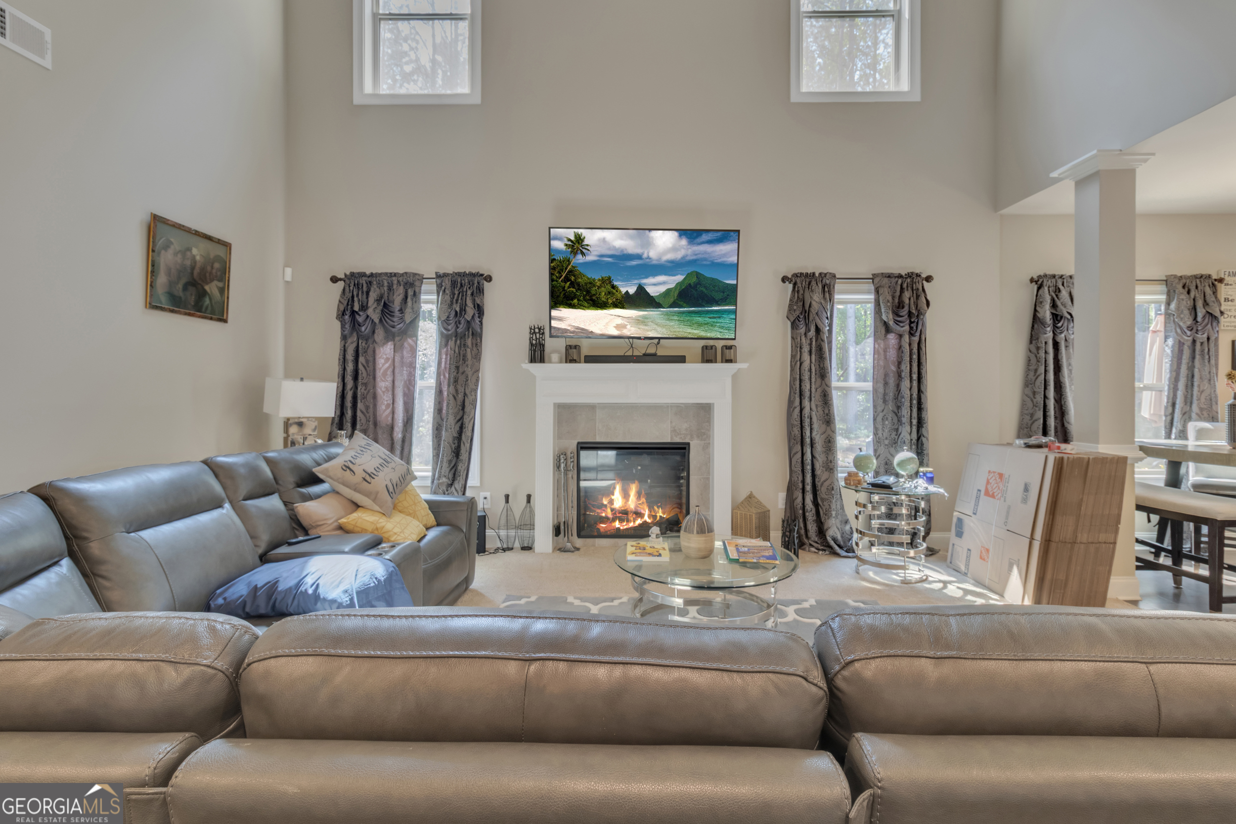 11614 Alcovy Road Covington, GA 30014 - Photo 21 of 62 a living room with furniture and a fireplace