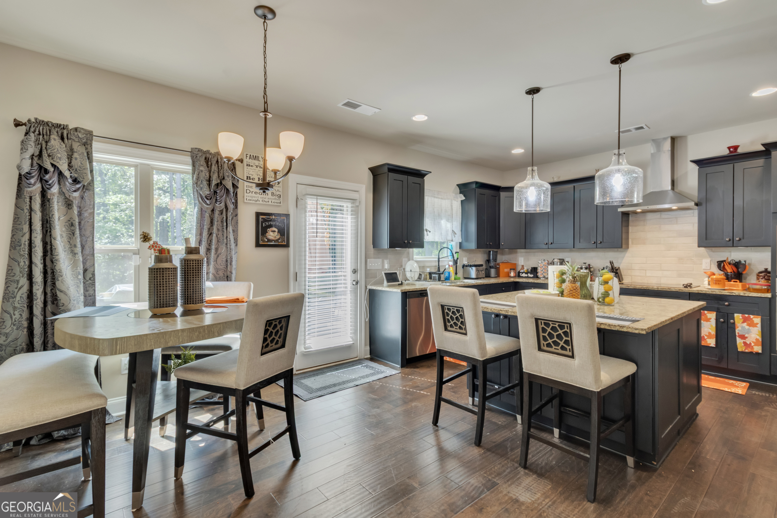 11614 Alcovy Road Covington, GA 30014 - Photo 24 of 62 a dining room filled with furniture and kitchen view