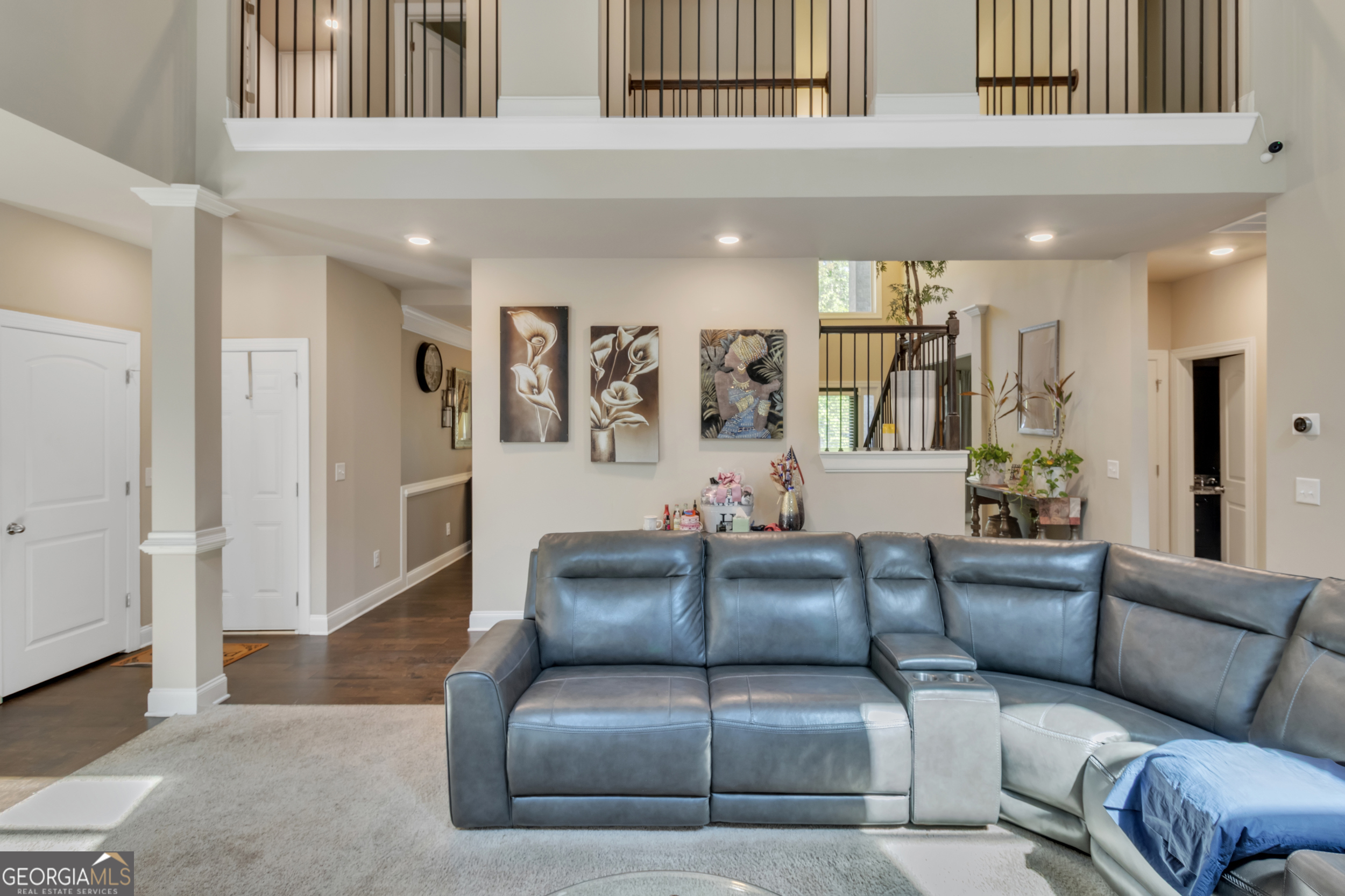 11614 Alcovy Road Covington, GA 30014 - Photo 29 of 62 a living room with furniture and a ceiling fan