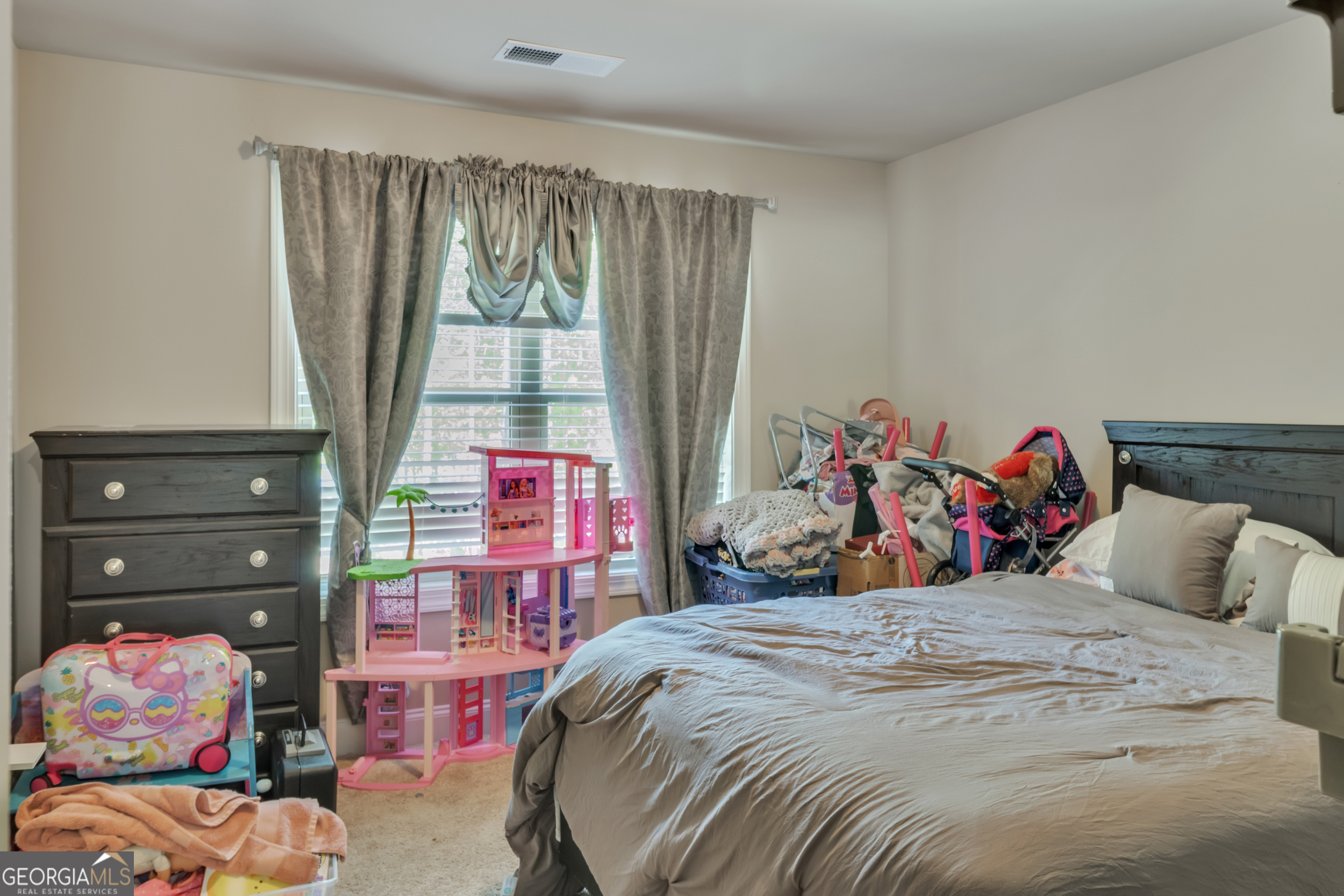 11614 Alcovy Road Covington, GA 30014 - Photo 45 of 62 a bedroom with a bed and a window