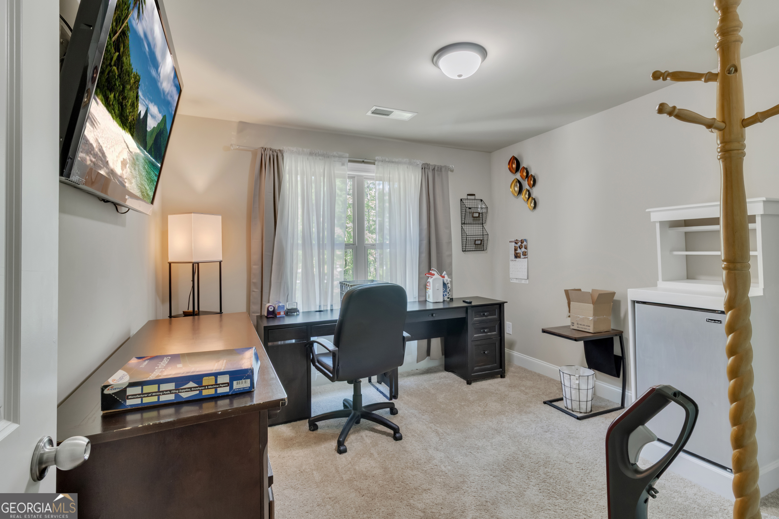 11614 Alcovy Road Covington, GA 30014 - Photo 47 of 62 a workspace with furniture hardwood and a window