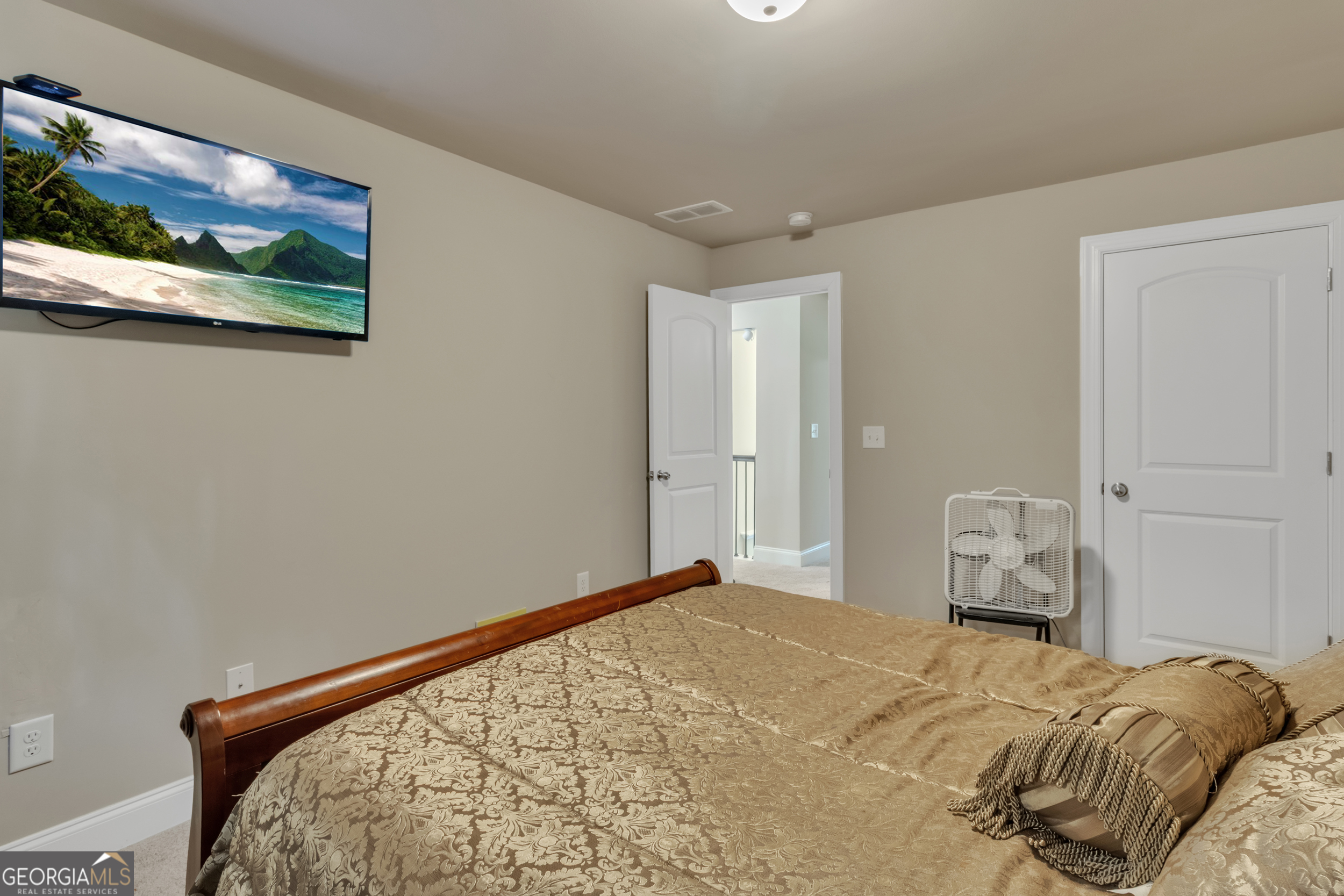 11614 Alcovy Road Covington, GA 30014 - Photo 51 of 62 a bedroom with a bed and wall painting