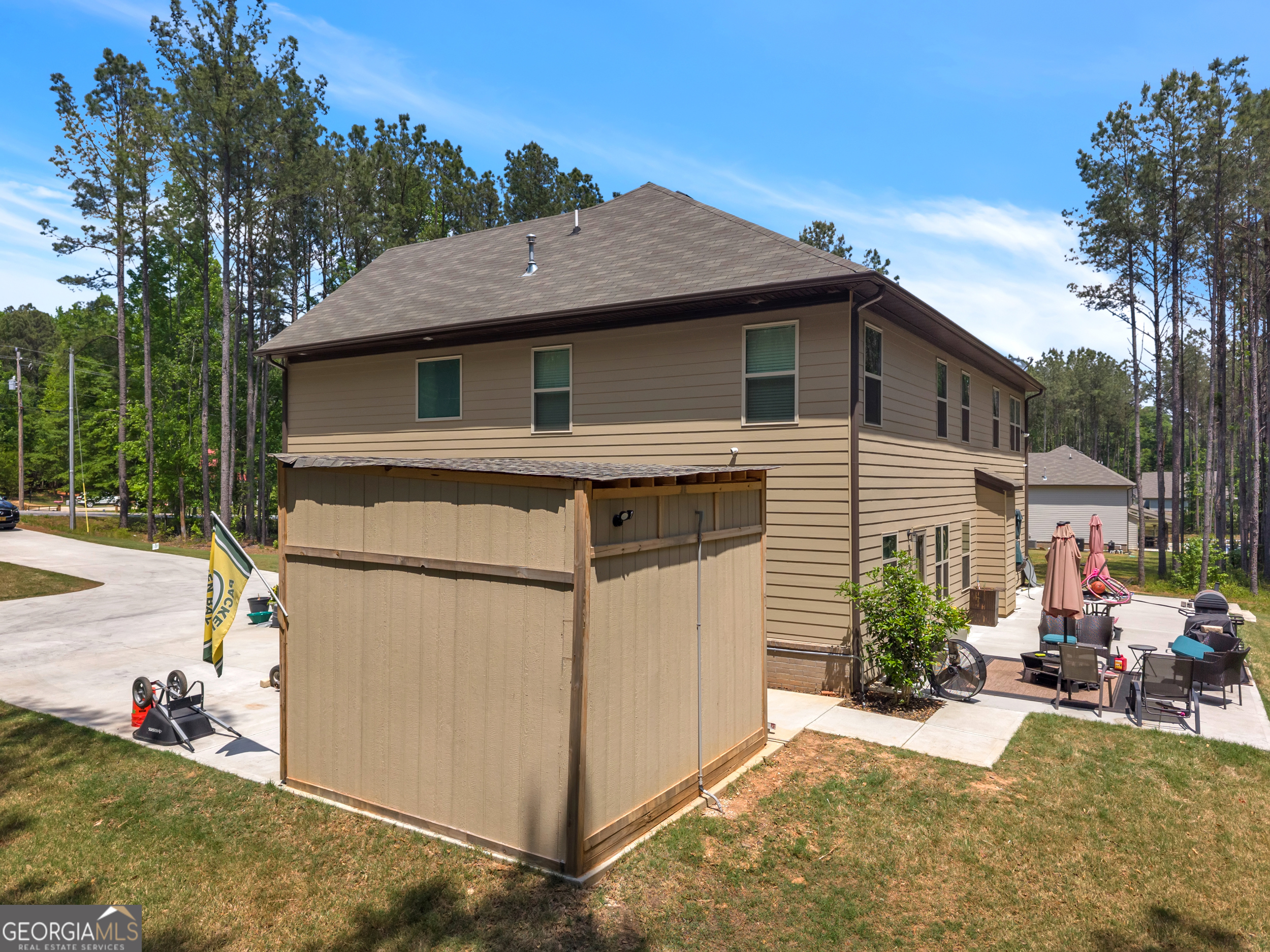 11614 Alcovy Road Covington, GA 30014 - Photo 57 of 62 a view of a house with a yard and sitting area