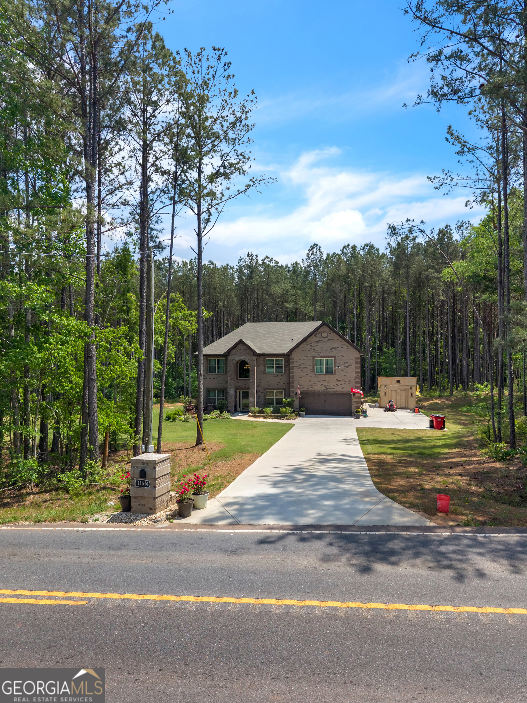 11614 Alcovy Road Covington, GA 30014 - Photo 62 of 62 a view of a house with a big yard plants and large trees