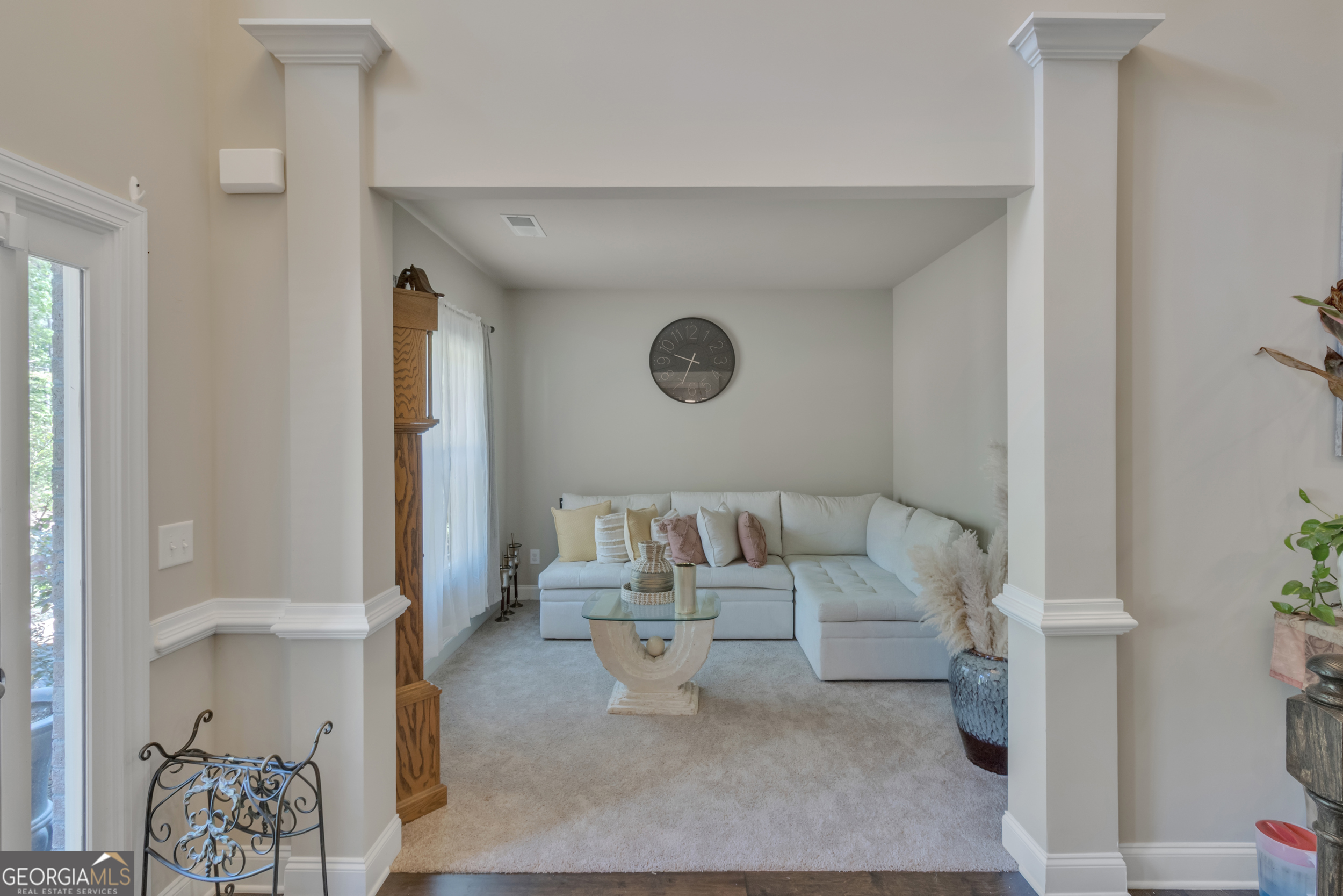 11614 Alcovy Road Covington, GA 30014 - Photo 10 of 62 a living room with furniture and a painting on the wall