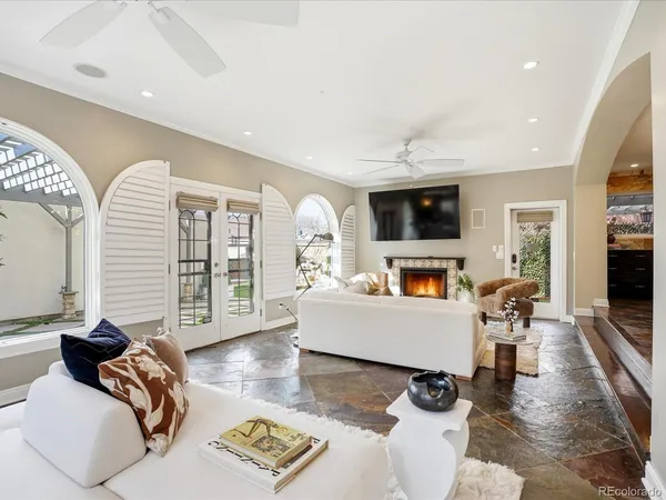 a view of a living room and entryway with wooden floor