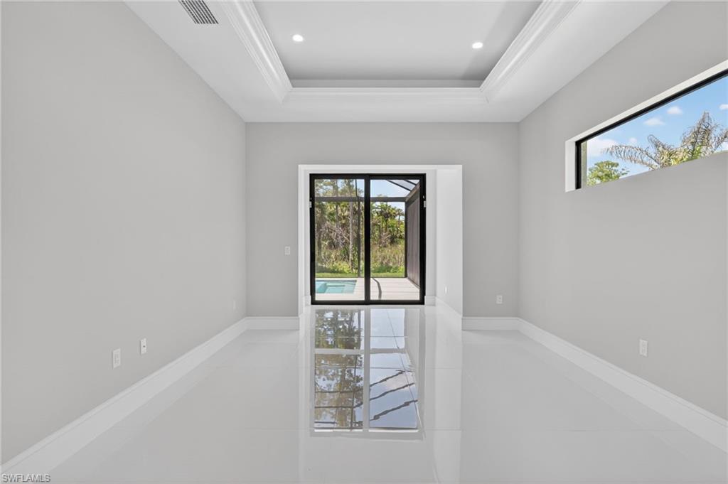 563 15th Street Northwest Naples, FL 34120 - Photo 9 of 22 an empty room with windows
