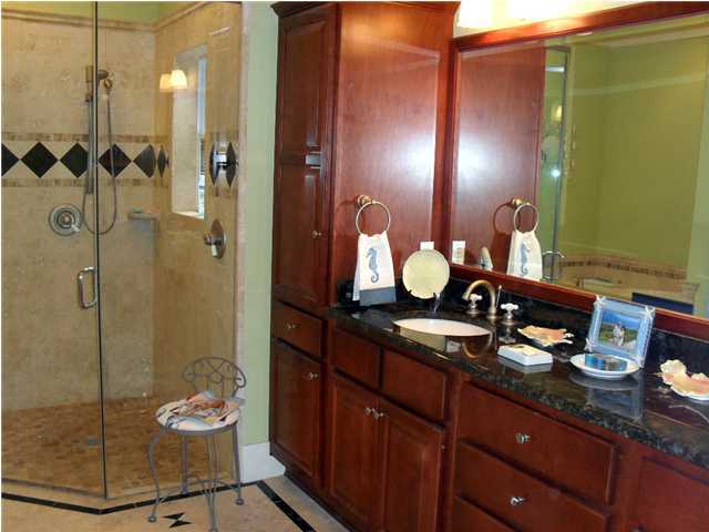 203 Seacrest Beach Boulevard East Seacrest, FL 32461 - Photo 16 of 24 a bathroom with a sink mirror and shower