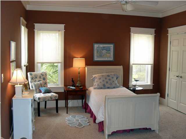 203 Seacrest Beach Boulevard East Seacrest, FL 32461 - Photo 18 of 24 a bedroom with a bed and a couch next to a window