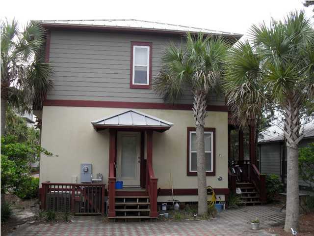 203 Seacrest Beach Boulevard East Seacrest, FL 32461 - Photo 22 of 24 a view of a house with many windows and plants
