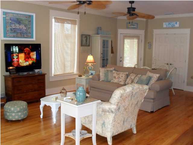 203 Seacrest Beach Boulevard East Seacrest, FL 32461 - Photo 6 of 24 a living room with furniture a flat screen tv and kitchen view