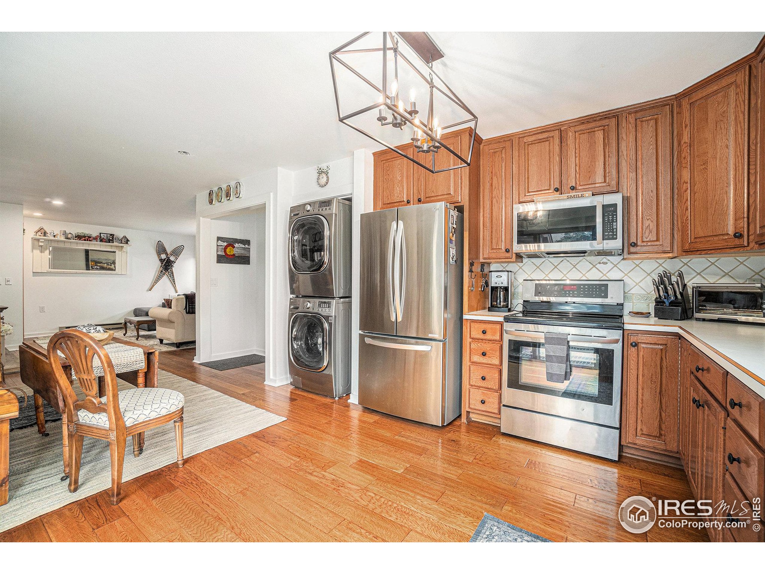 1422 Matthew Circle, Unit 2 Estes Park, CO 80517 - Photo 11 of 30 a kitchen with stainless steel appliances a stove a refrigerator and a sink