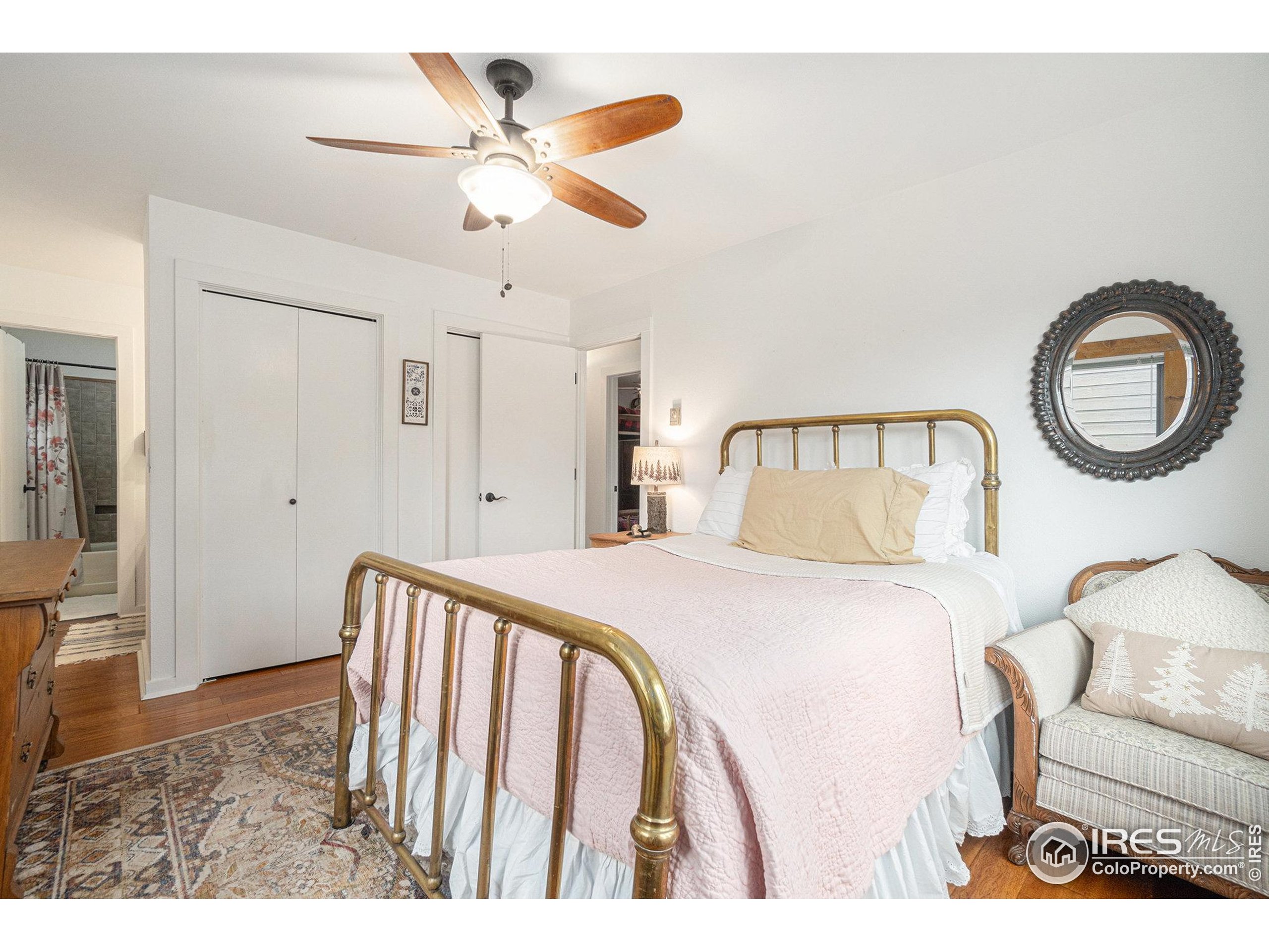 1422 Matthew Circle, Unit 2 Estes Park, CO 80517 - Photo 15 of 30 a bedroom with a bed and a painting on the wall