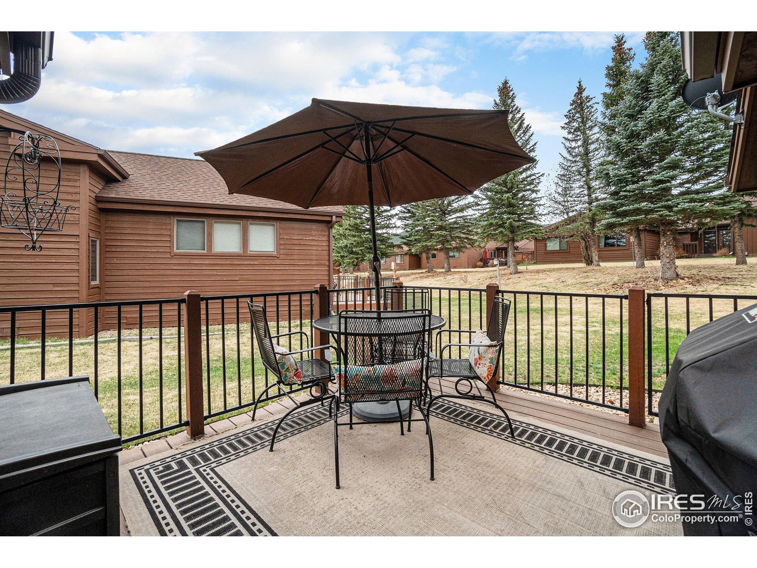1422 Matthew Circle, Unit 2 Estes Park, CO 80517 - Photo 22 of 30 a view of balcony with wooden floor