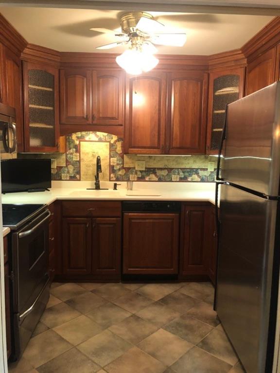 1500 Cochran Road, Unit 611 Pittsburgh, PA 15243 - Photo 11 of 25 Stunning cabinetry and crown molding grace this beautiful kitchen. Stainless appliances, Corian counter, and ceiling fan light finish the look