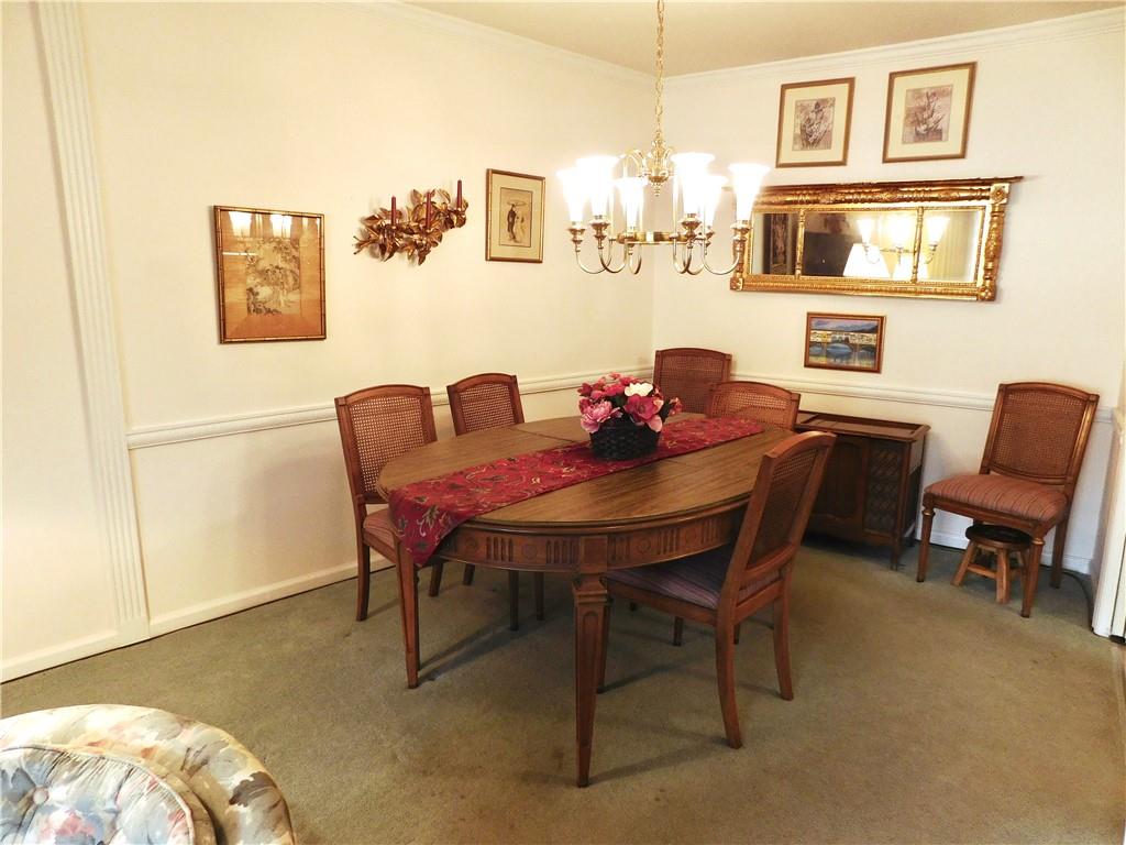 1500 Cochran Road, Unit 611 Pittsburgh, PA 15243 - Photo 9 of 25 Dining room is ample enough for a generously sized table that could extend to toward the living room space if needed for larger gatherings of family and friends.