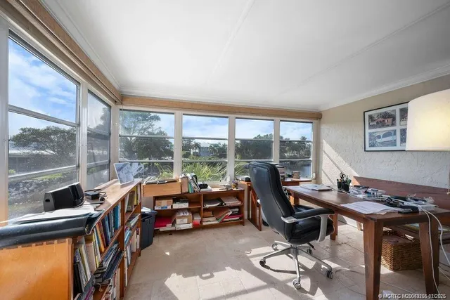 a reading room with furniture and a book shelf