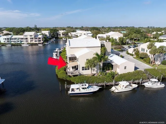 an aerial view of a house with a lake view