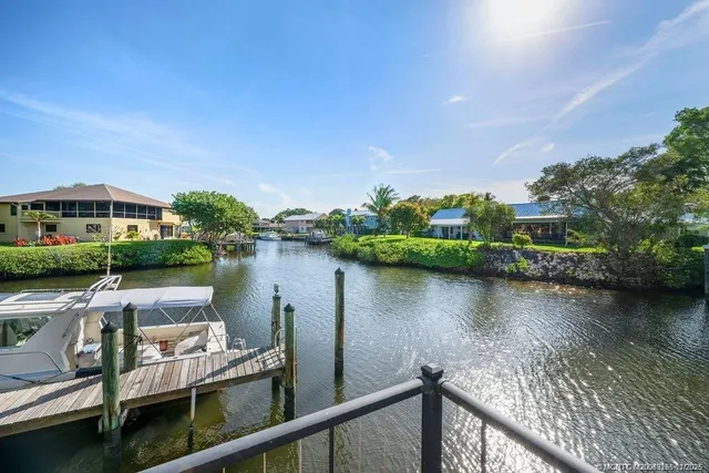 a view of a lake with a house in the background