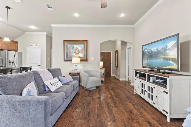 a view of a dining room with furniture and a chandelier