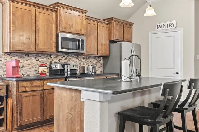 a bathroom with a tub sink and toilet
