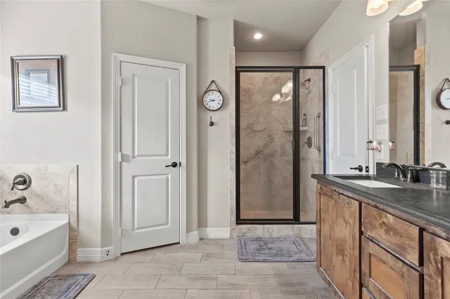 a living room with furniture and a ceiling fan