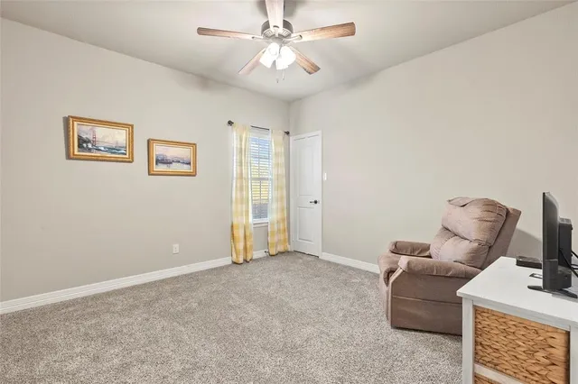 a utility room with dryer washer and a fridge