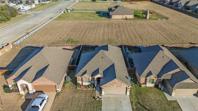 a view of a house with a yard and garage