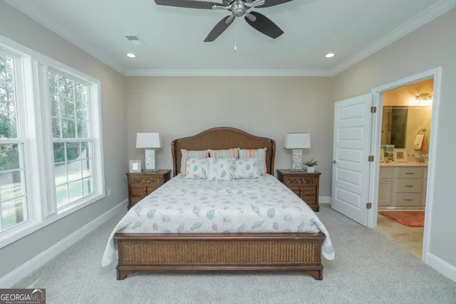 a spacious bedroom with a bed and a table