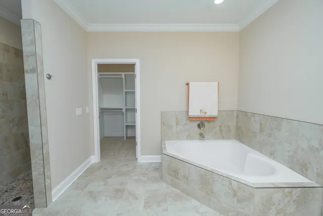 a bathroom with a bathtub and a sink