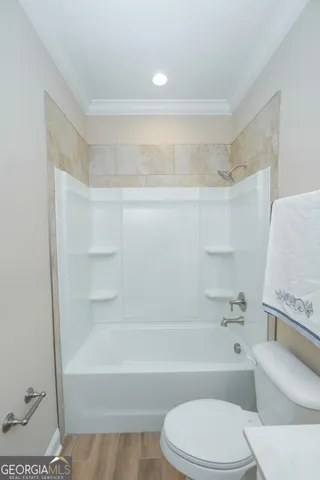 a living room with furniture a table and a window