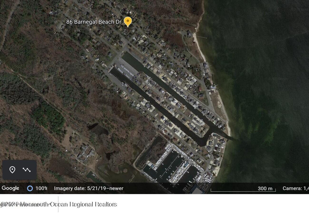 86 Barnegat Beach Drive Waretown, NJ 08758 - Photo 2 of 4 a black and white photo of a house