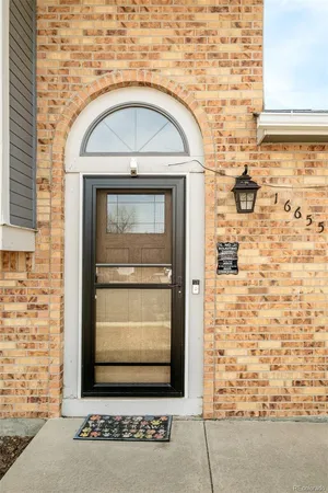 a front view of a house with parking