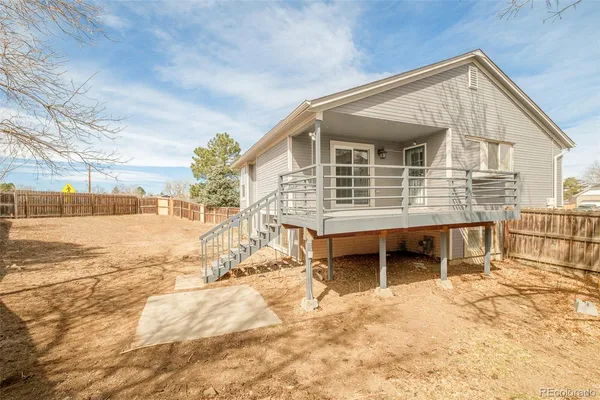 a view of a house with a barbeque