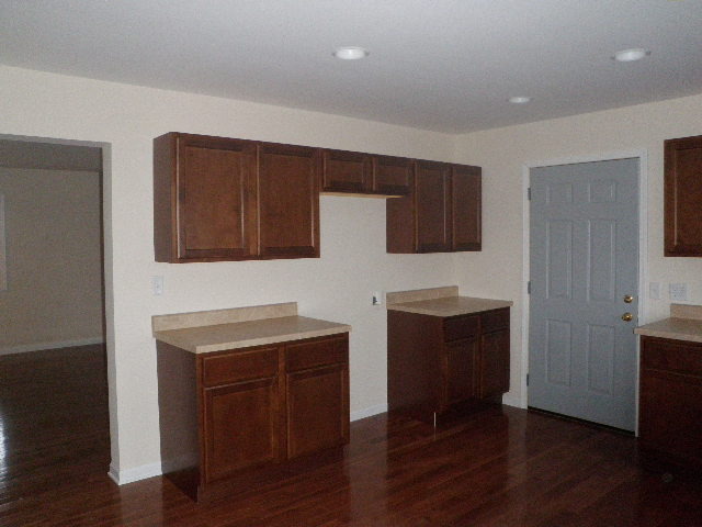 7200 West Grand Ridge Road Verona, IL 60479 - Photo 3 of 14 a kitchen with granite countertop wooden floors and wooden cabinets