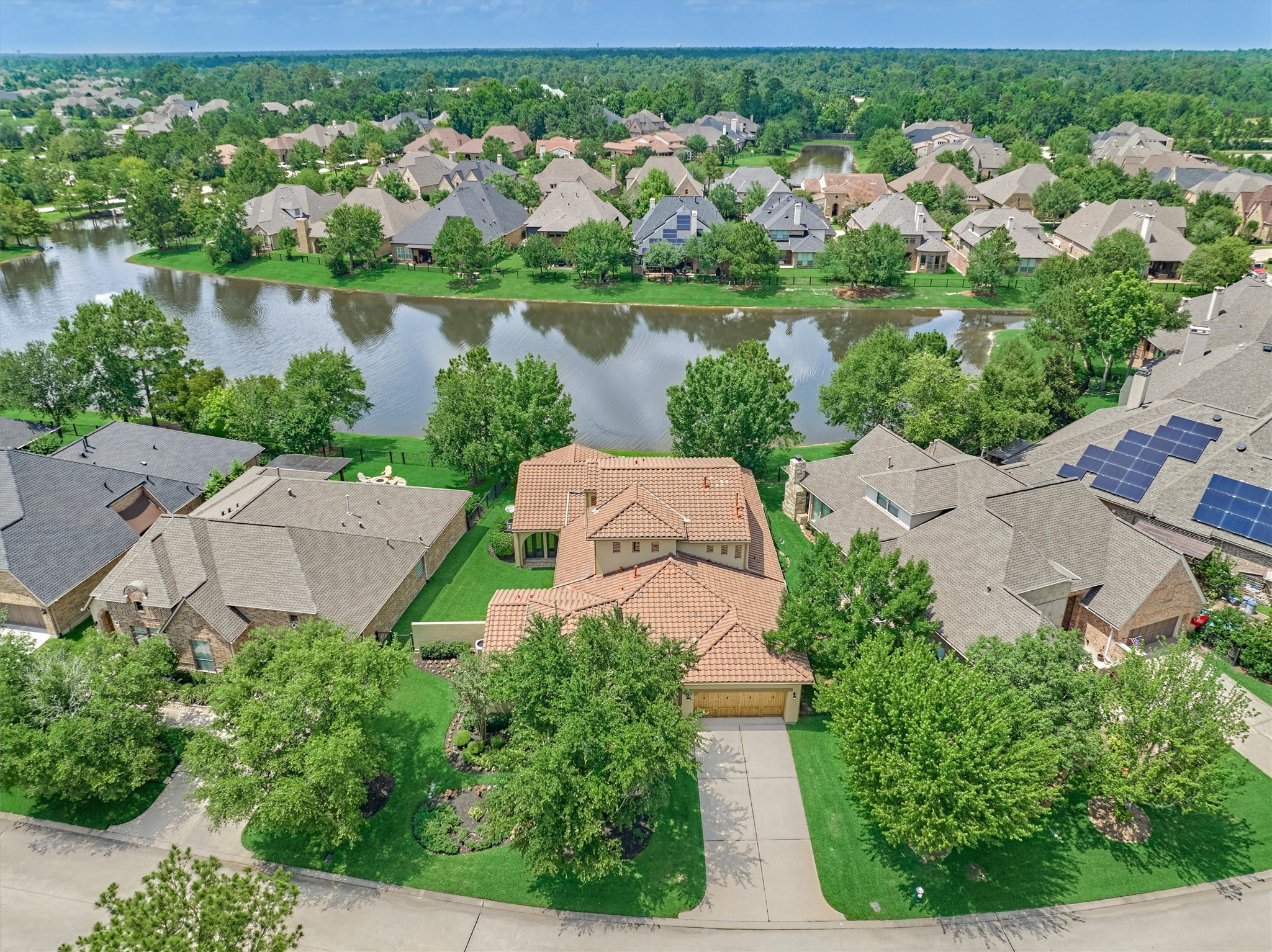 82 East Crystal Canyon Circle The Woodlands, TX 77389 - Photo 2 of 50 Aerial view of this majestic waterfront retreat in the coveted Creekside Village of The Woodlands.