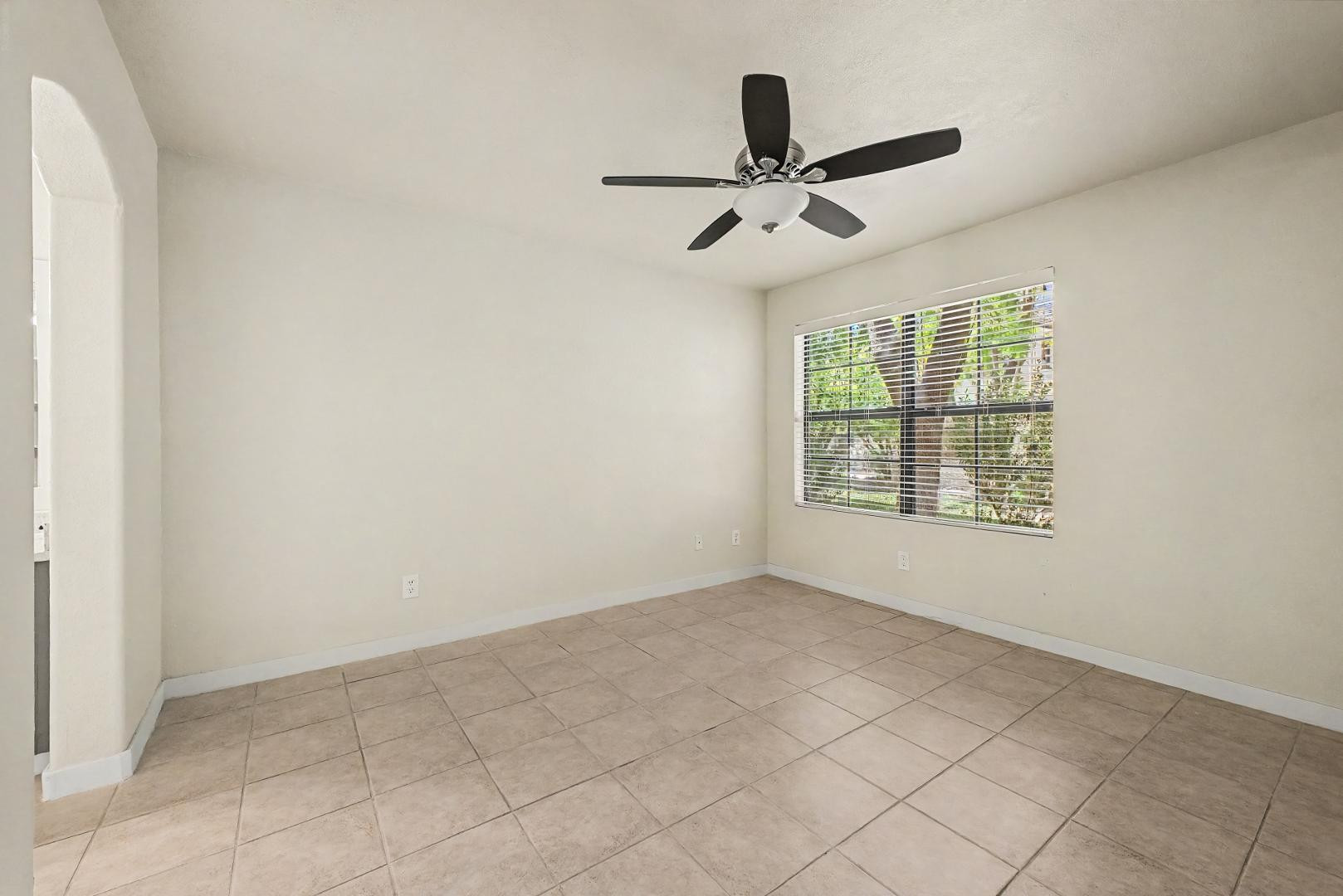 6885 East Cochise Road, Unit 142 Paradise Valley, AZ 85253 - Photo 18 of 47 an empty room with windows and fan