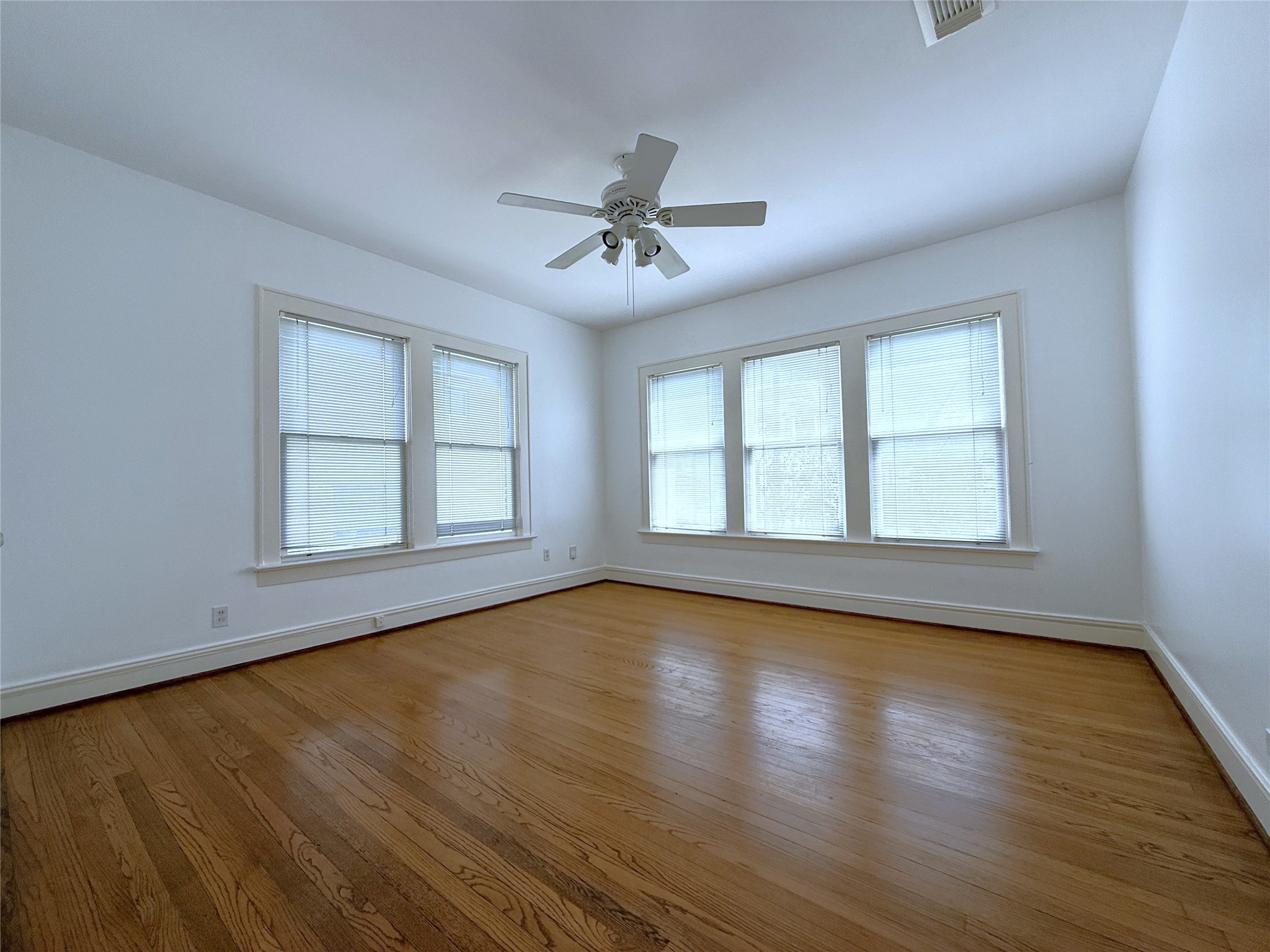 2311 Wroxton Road Houston, TX 77005 - Photo 17 of 24 The 1st bedroom with ceiling fan/light fixture.