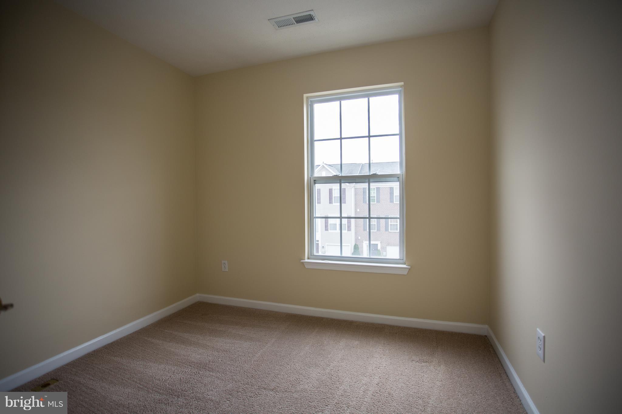 9856 Decatur Road Baltimore, MD 21220 - Photo 22 of 29 an empty room with a window