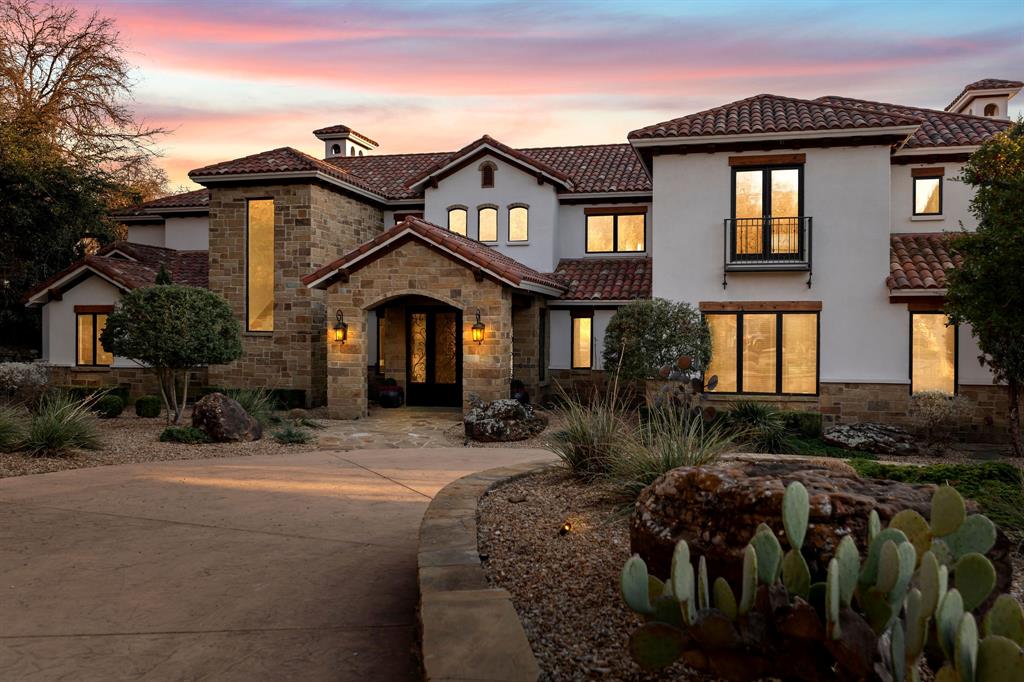 9930 Boat Club Road Fort Worth, TX 76179 - Photo 28 of 40 This twilight view of the primary residence speaks for itself!