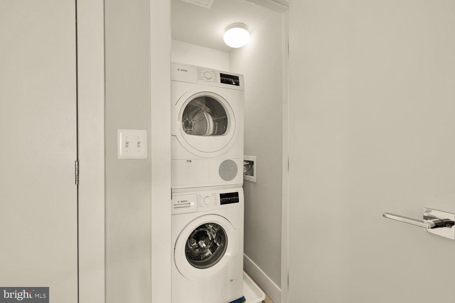 1311 13th Street Northwest, Unit 305 Washington, DC 20005 - Photo 26 of 29 a view of a hallway with washer and dryer